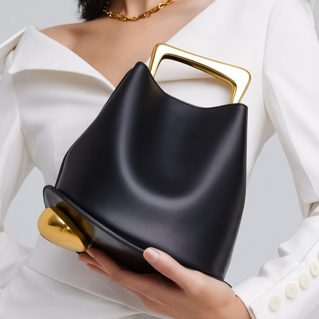 Black Leather Bag with Gold Metal Handle | Modern Bucket Bag Statement Piece