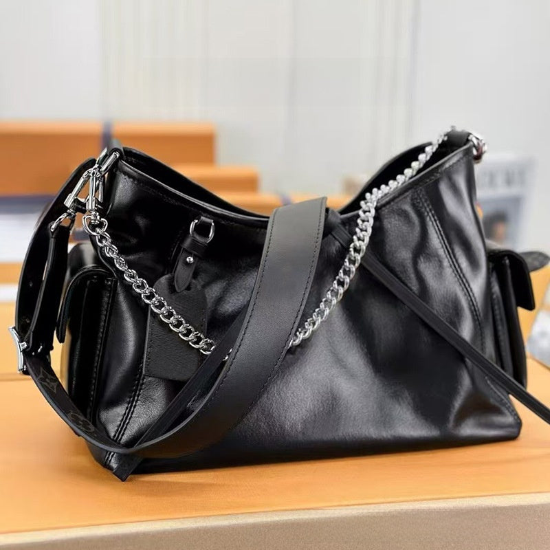 Black Leather Hobo Bag with Chain Detail | Glossy Shoulder Bag with Tassels