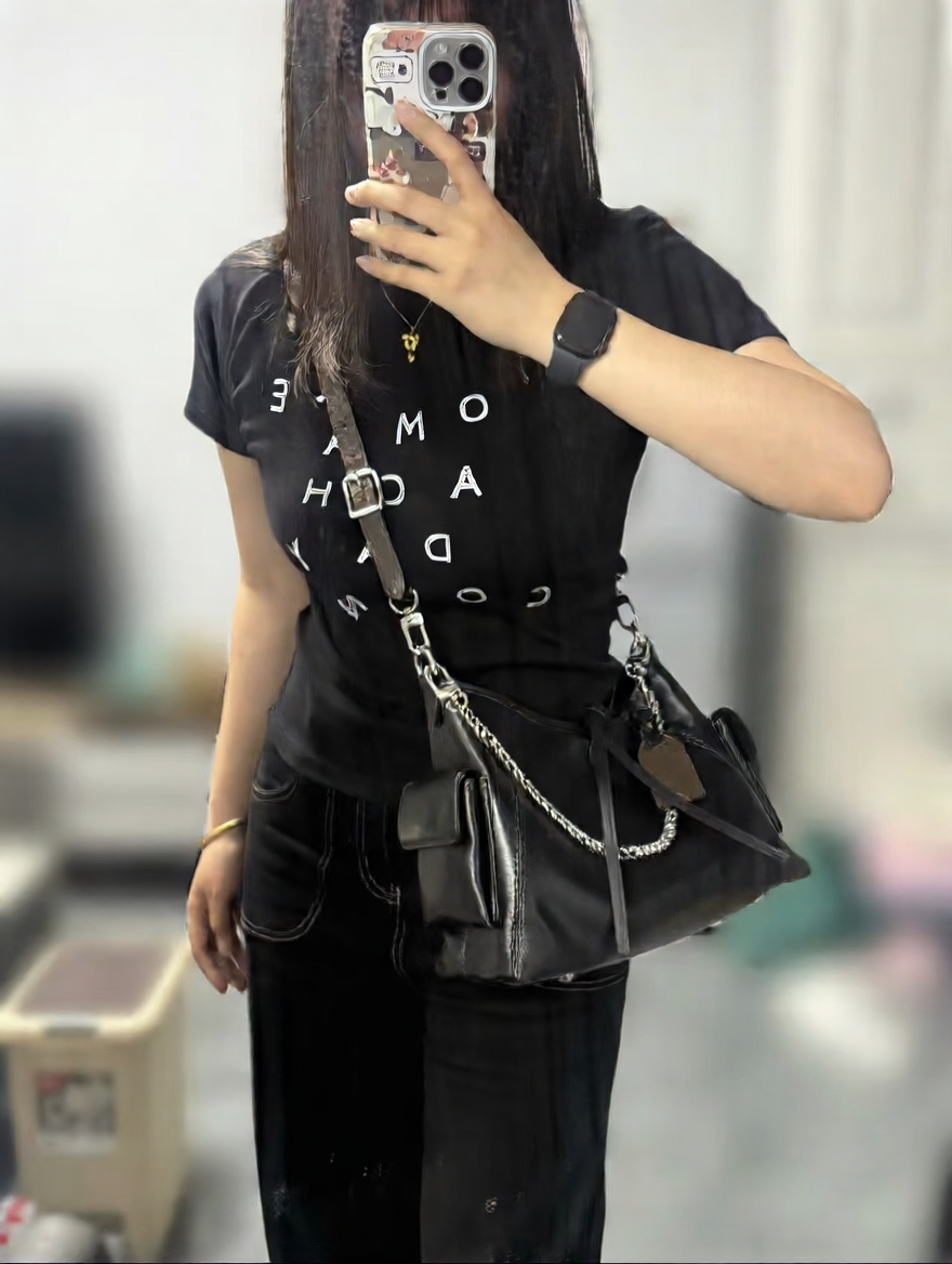 Black Leather Hobo Bag with Chain Detail | Glossy Shoulder Bag with Tassels