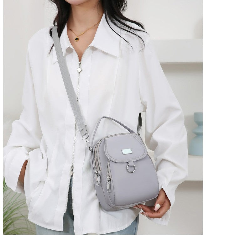 Black Nylon Mini Backpack - Convertible Crossbody Bag with Multiple Compartments | Lightweight Travel Bag with Silver Hardware