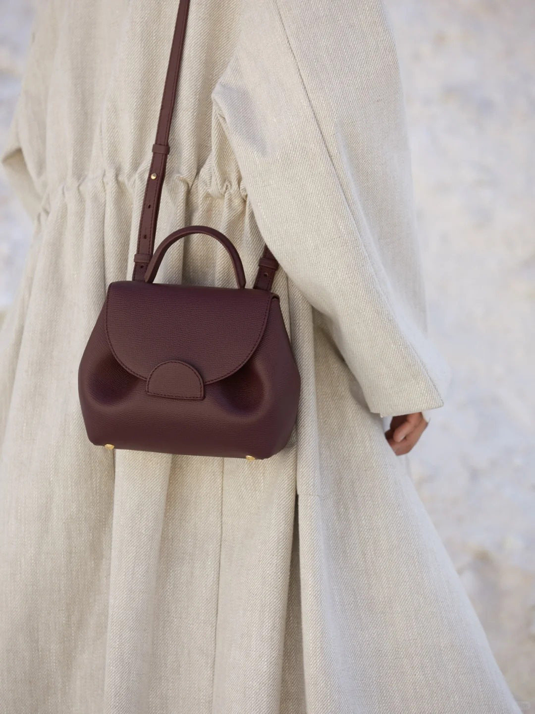 Polene Black Leather Structured Handbag with Curved Flap | Modern Top Handle Bag