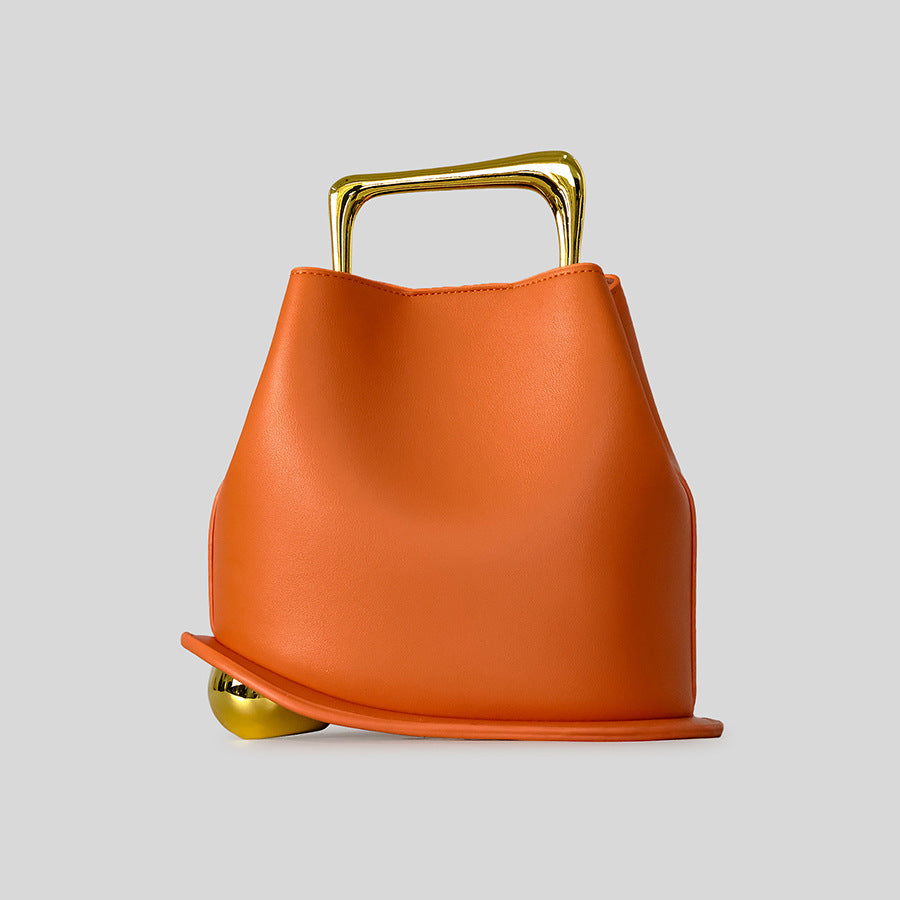 Black Leather Bag with Gold Metal Handle | Modern Bucket Bag Statement Piece