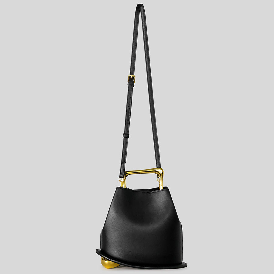 Black Leather Bag with Gold Metal Handle | Modern Bucket Bag Statement Piece