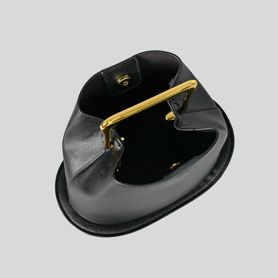 Black Leather Bag with Gold Metal Handle | Modern Bucket Bag Statement Piece
