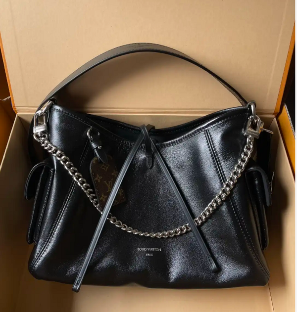 Black Leather Hobo Bag with Chain Detail | Glossy Shoulder Bag with Tassels