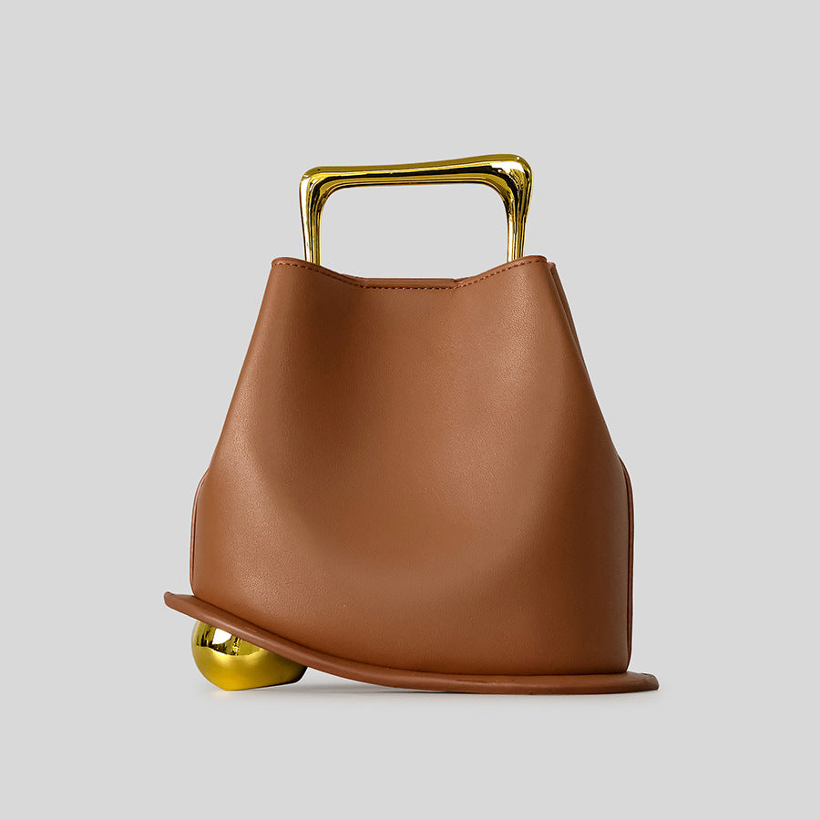 Black Leather Bag with Gold Metal Handle | Modern Bucket Bag Statement Piece