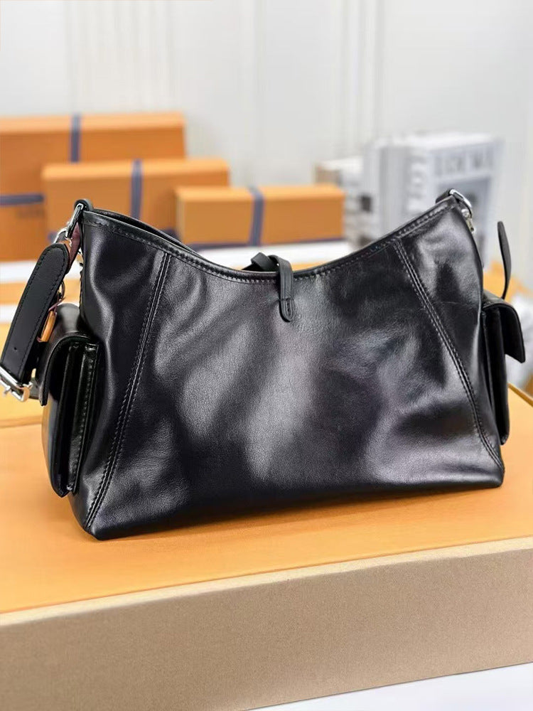 Black Leather Hobo Bag with Chain Detail | Glossy Shoulder Bag with Tassels