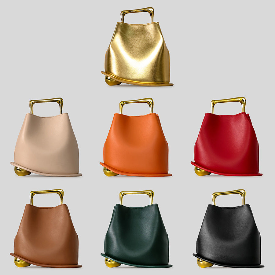 Black Leather Bag with Gold Metal Handle | Modern Bucket Bag Statement Piece